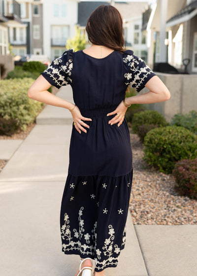 Back view of the modest navy embroidered dress