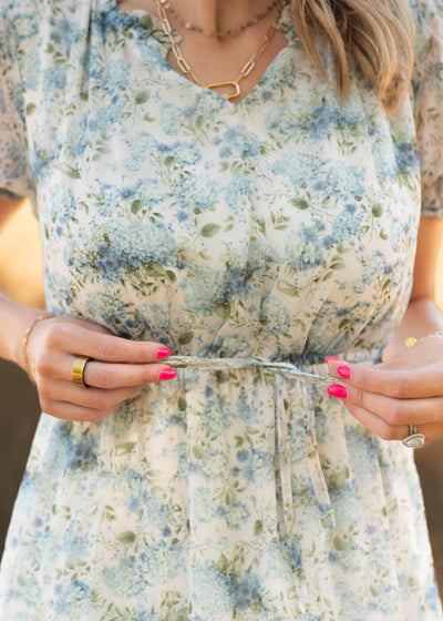 Close up of the tie at the waist on the vintage white floral dress