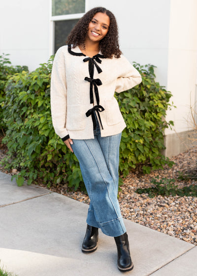 Cream bow cardigan with long sleeves
