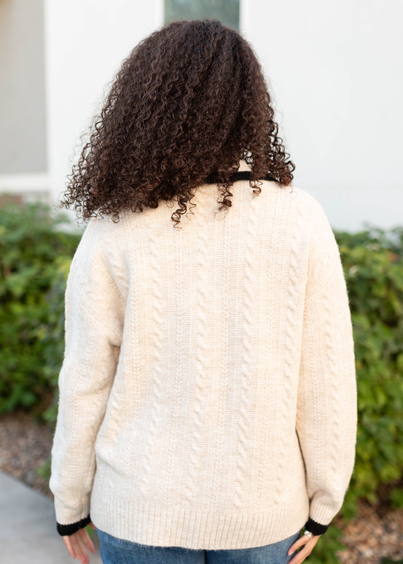 Back view of the cream bow cardigan