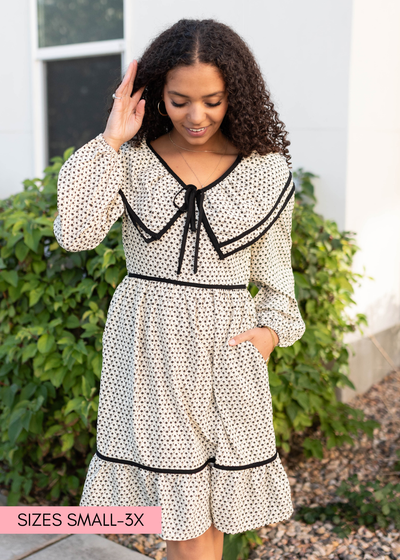 Cream ruffle dress in a full range of sizes
