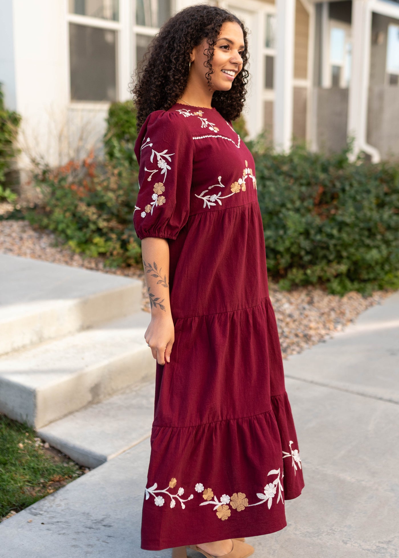 Side view of the burgundy floral dress