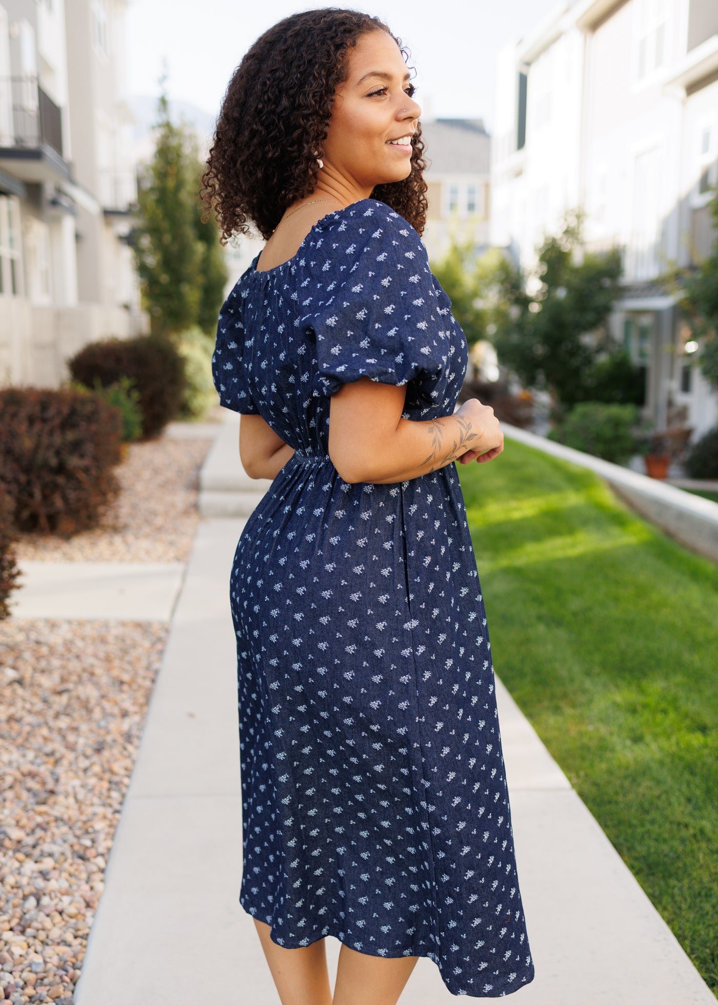 Side view of the floral denim dress with short sleeves