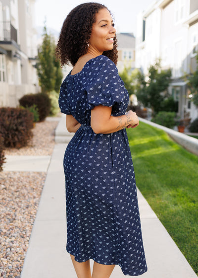 Side view of the floral denim dress with short sleeves
