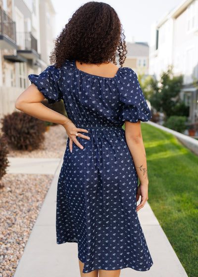 Back view of the floral denim dress with elastic waist