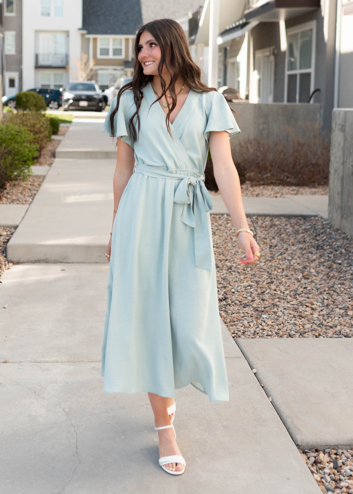 Wrap style bodice on the sage formal dress