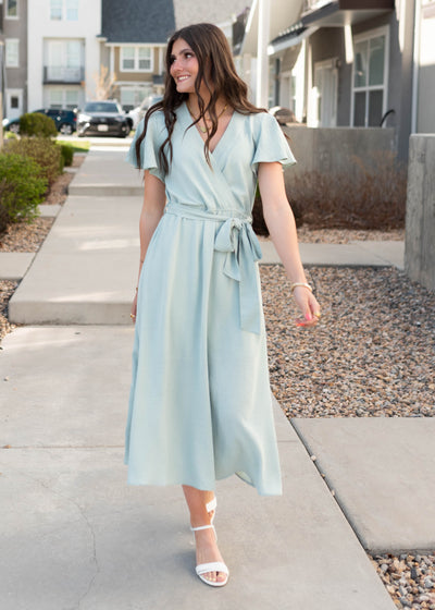 Wrap style bodice on the sage formal dress