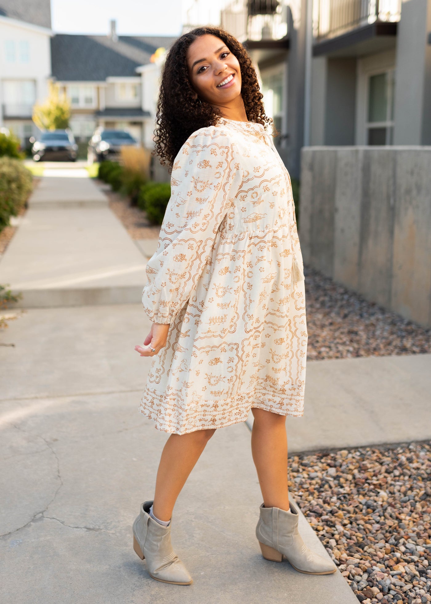 Side view of the cream patterned dress