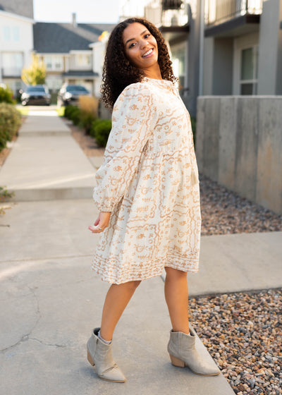 Side view of the cream patterned dress