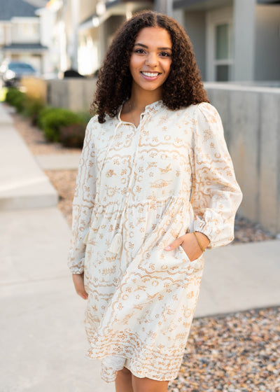 Modest knee length cream pattern dress with pockets