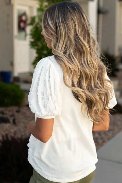 Side view of a white top