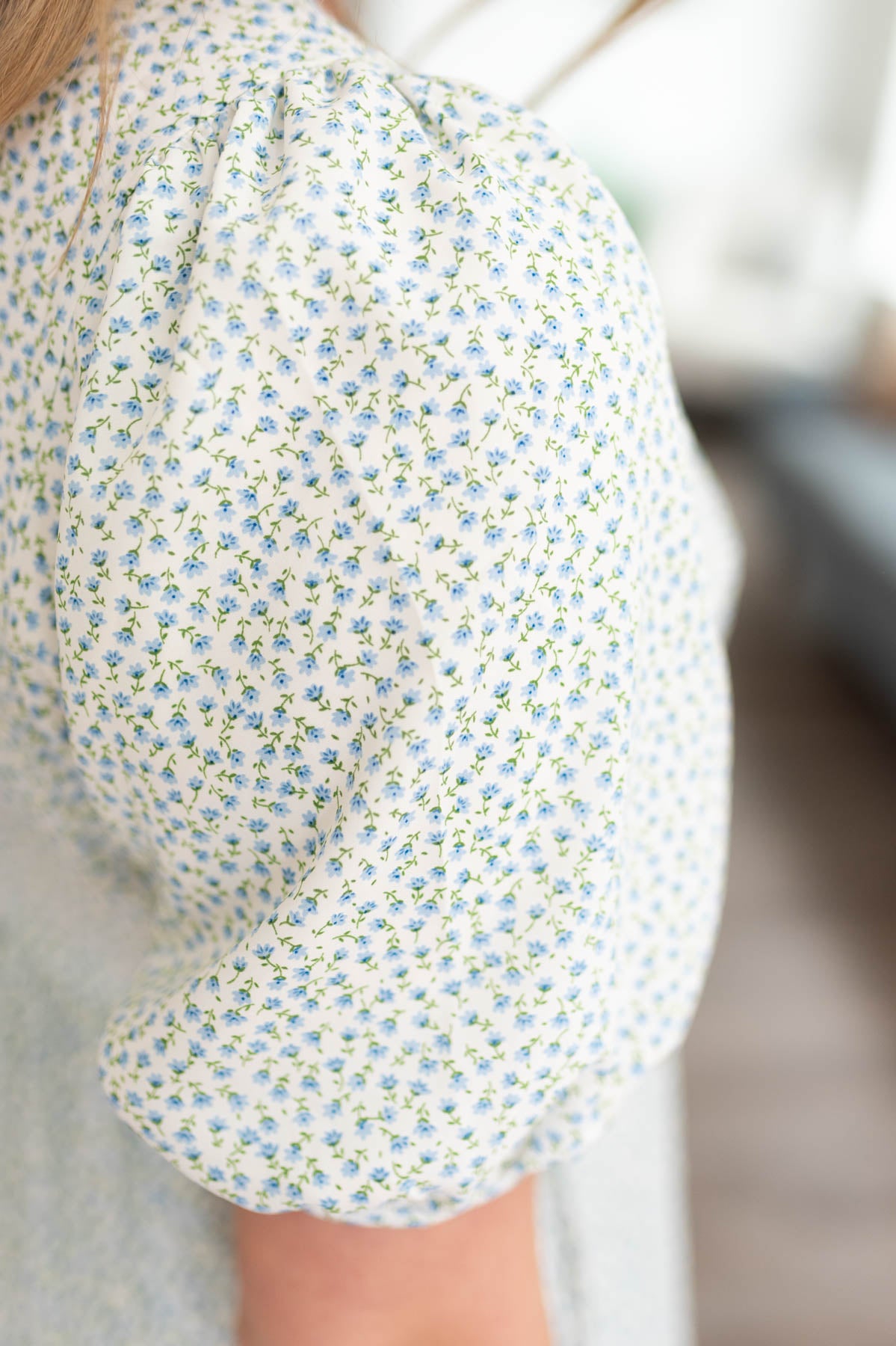 Close up of the print on the blue floral dress