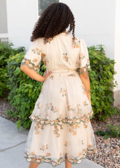 Back view of the modest wild flower taupe dress with embroidery
