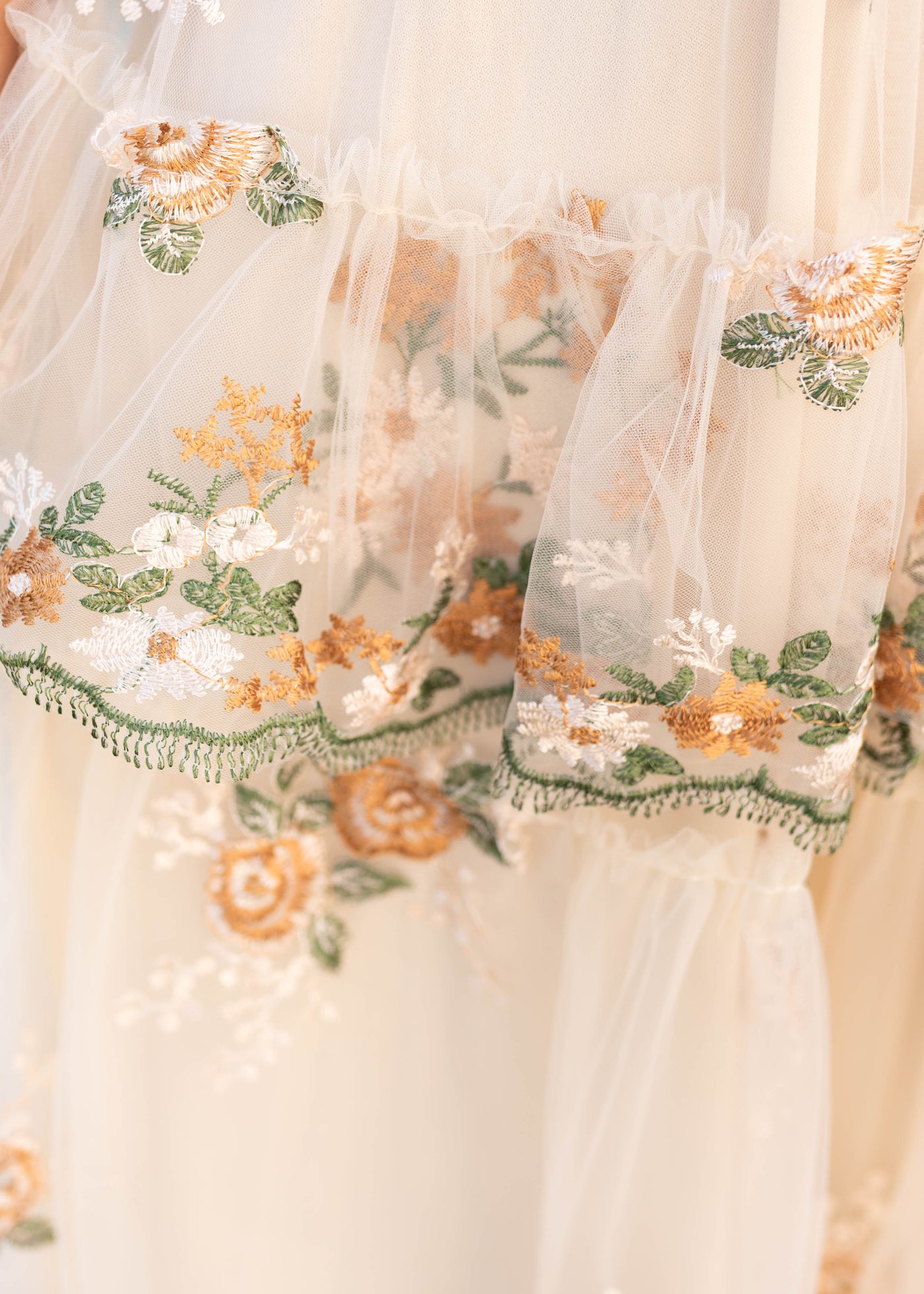Close up of the embroidery on the wild flower taupe dress