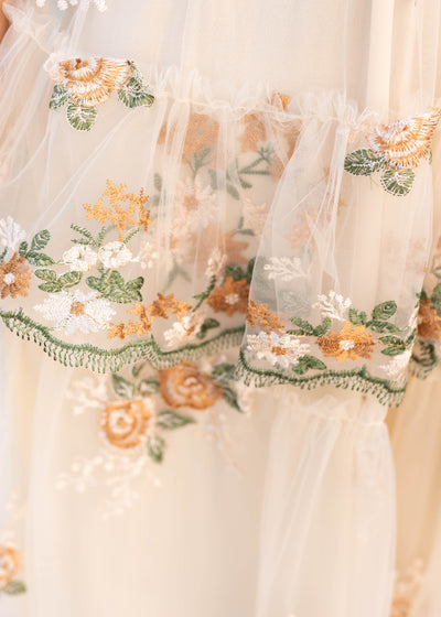 Close up of the embroidery on the wild flower taupe dress