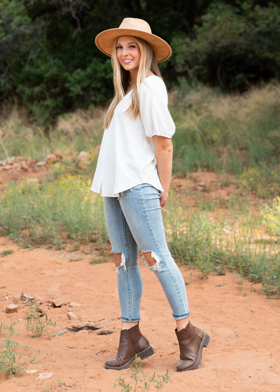 Side view of a short sleeve white top
