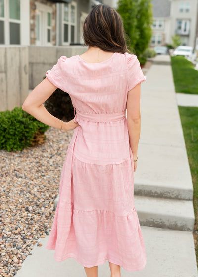 Back view of the blush pink tie waist dress