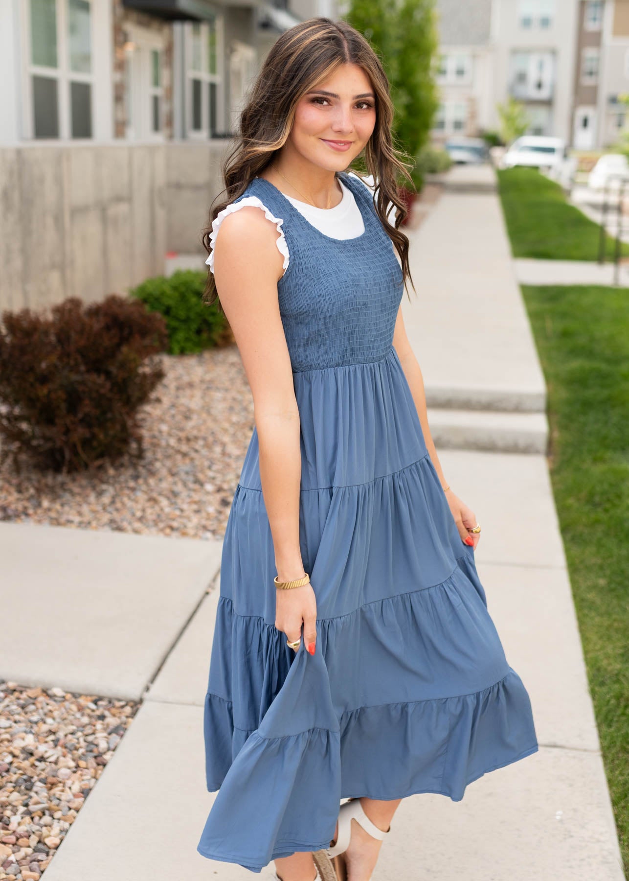 Side view of the dusty blue smocked dress