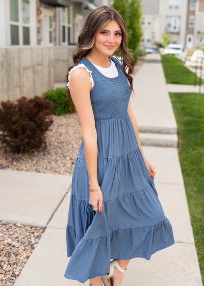 Side view of the dusty blue smocked dress