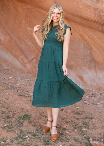 Sleeveless hunter green dress with smocked bodice