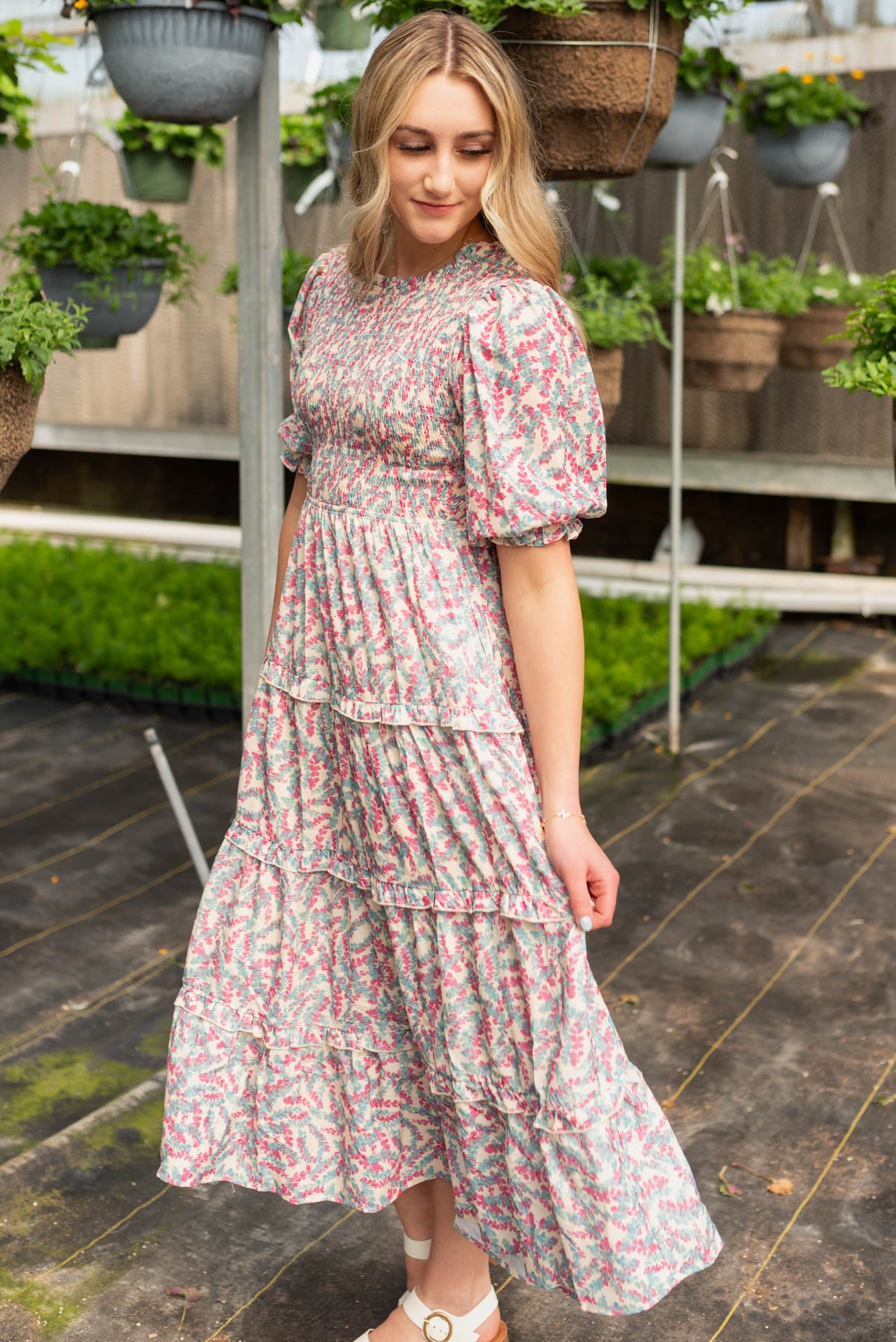 Side view of the blue floral smocked dress