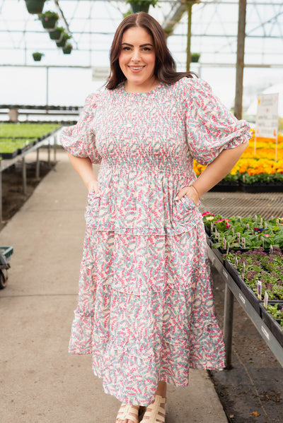 Short sleeve blue floral smocked dress with tiered skirt and pockets
