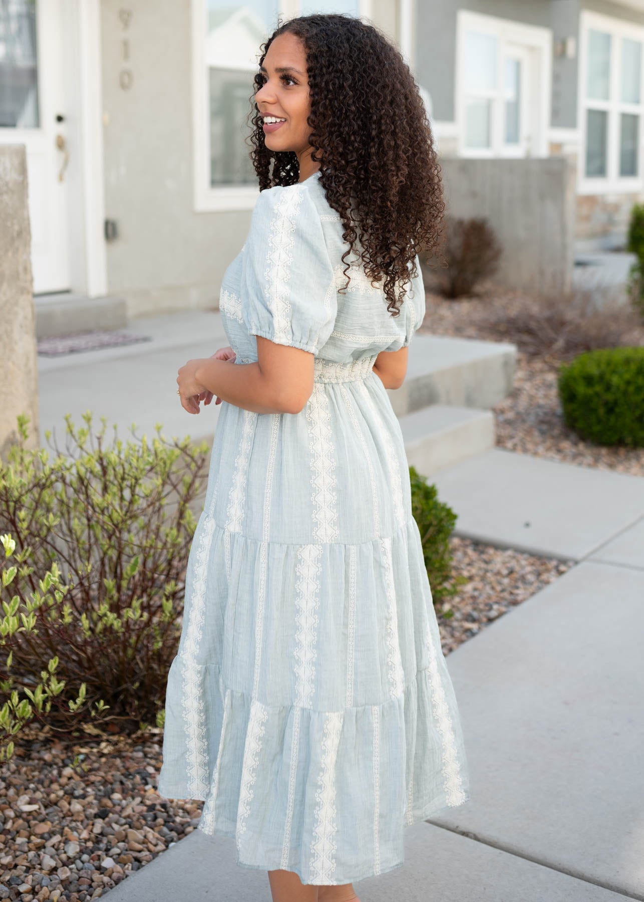 Side view of the light blue embroidered dress