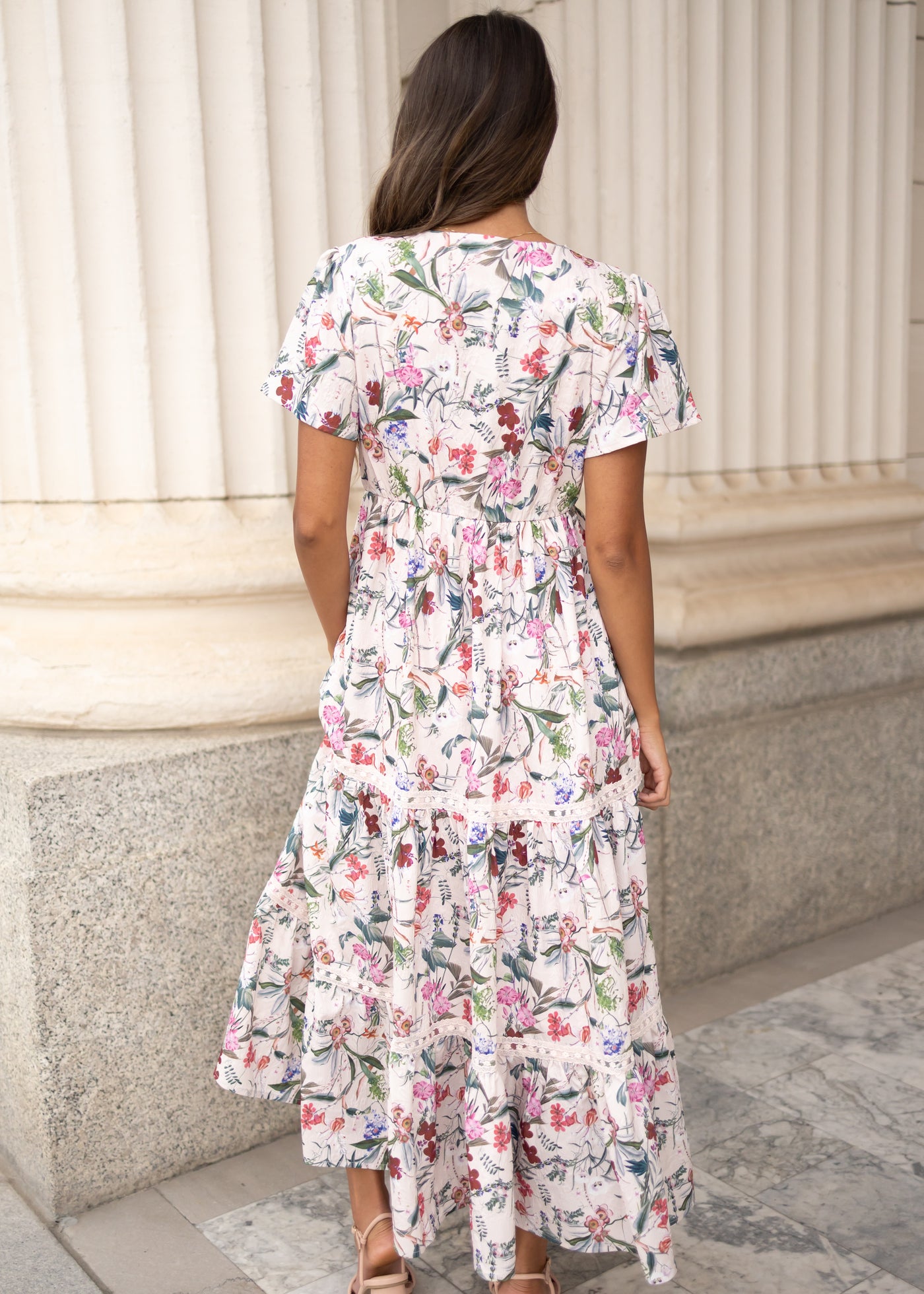 Back view of the pink floral tiered dress at Lena Layne