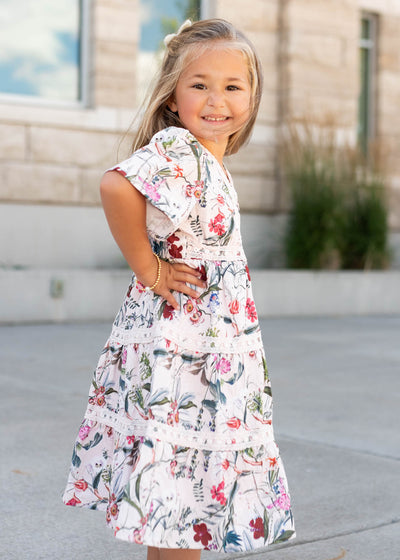 Side view of the pink floral tiered little girl dress by Lena Lou
