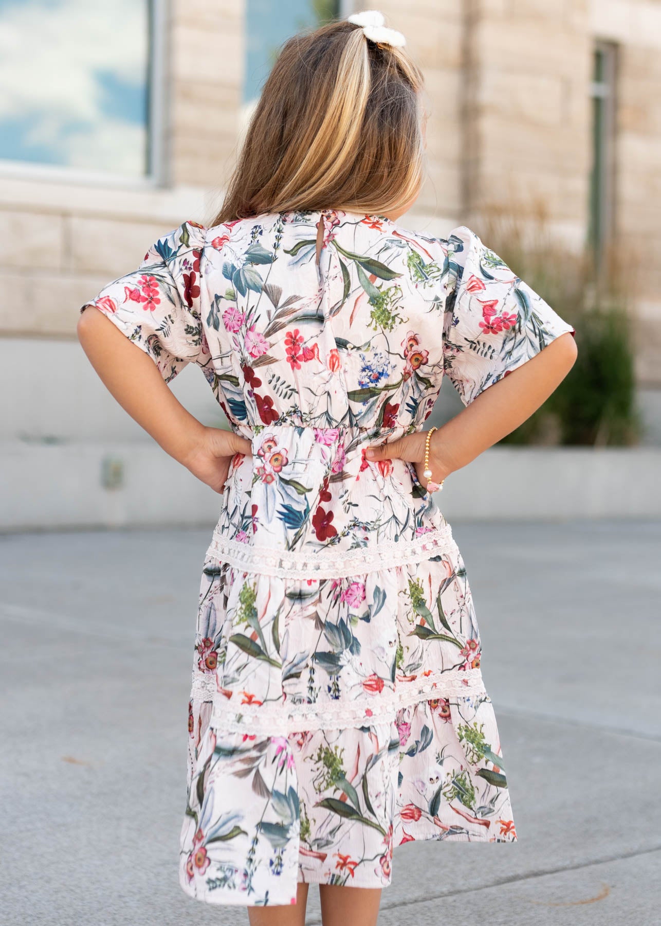 Back view of the pink floral tiered little girl dress