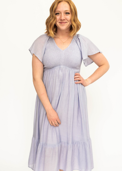 Short sleeve Lavender satin dress with a V-neck and smocked bodice.