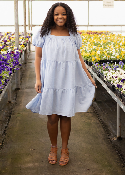 Knee length light blue dress with short sleeves