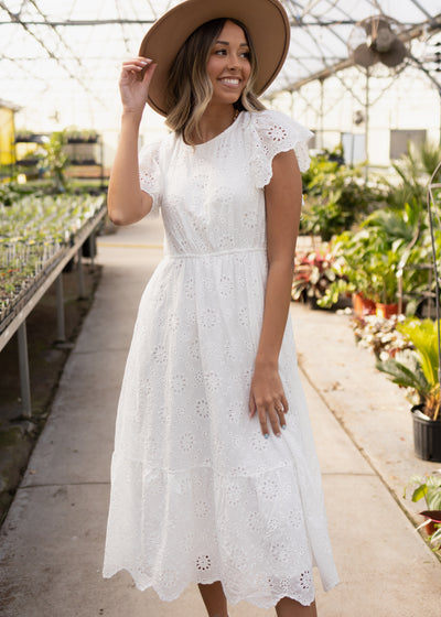 Short sleeve white eyelet dress with pockets and ruffle sleeves