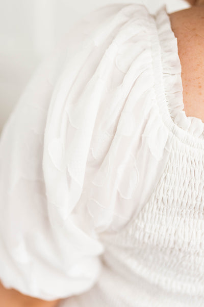 Sleeve of a plus size white dress