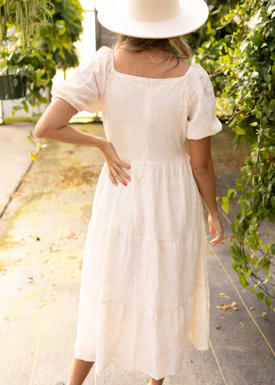 Back view of a cream dress