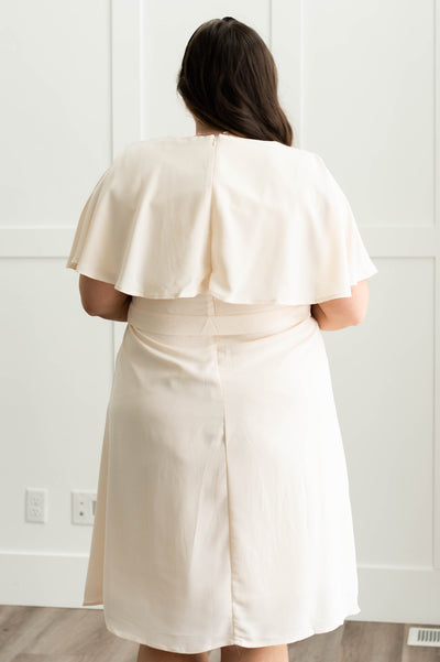 Back view of a plus size cream dress