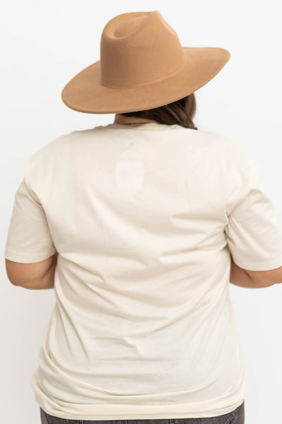 Back view of a white rodeo tee
