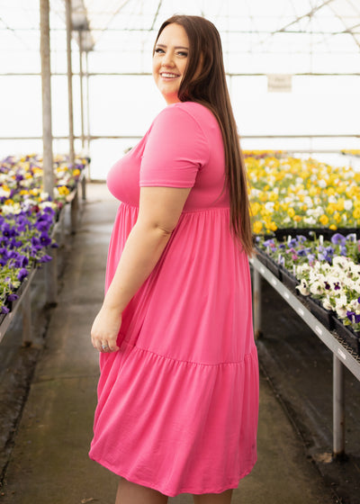 Side view of a knit fuchsia dress