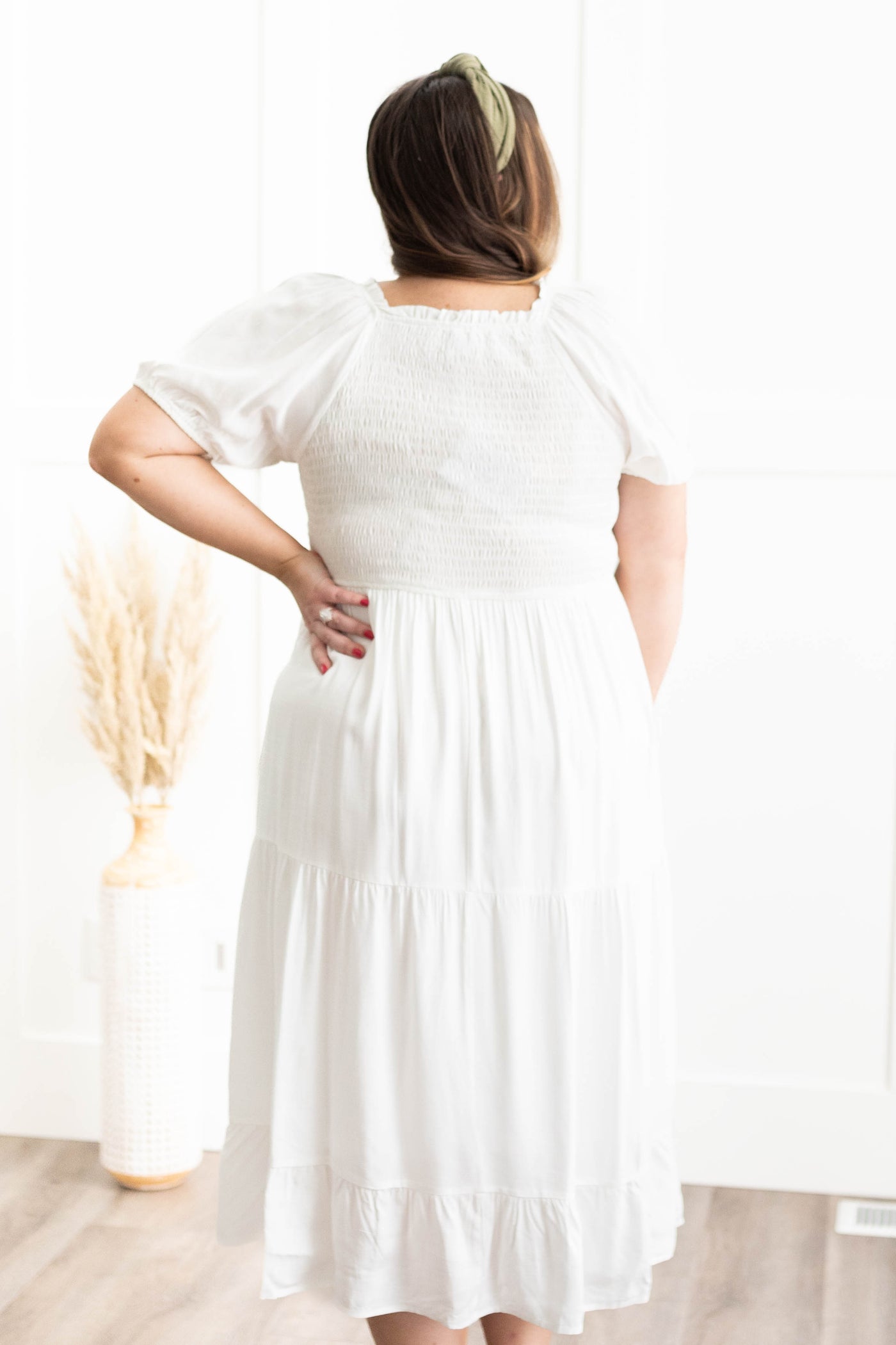 Back view of a plus size ivory dress