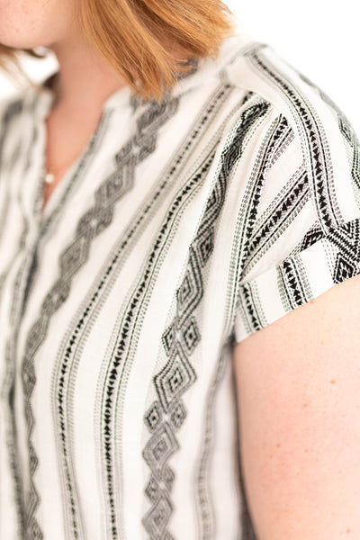 Rolled short sleeve white top with black pattern