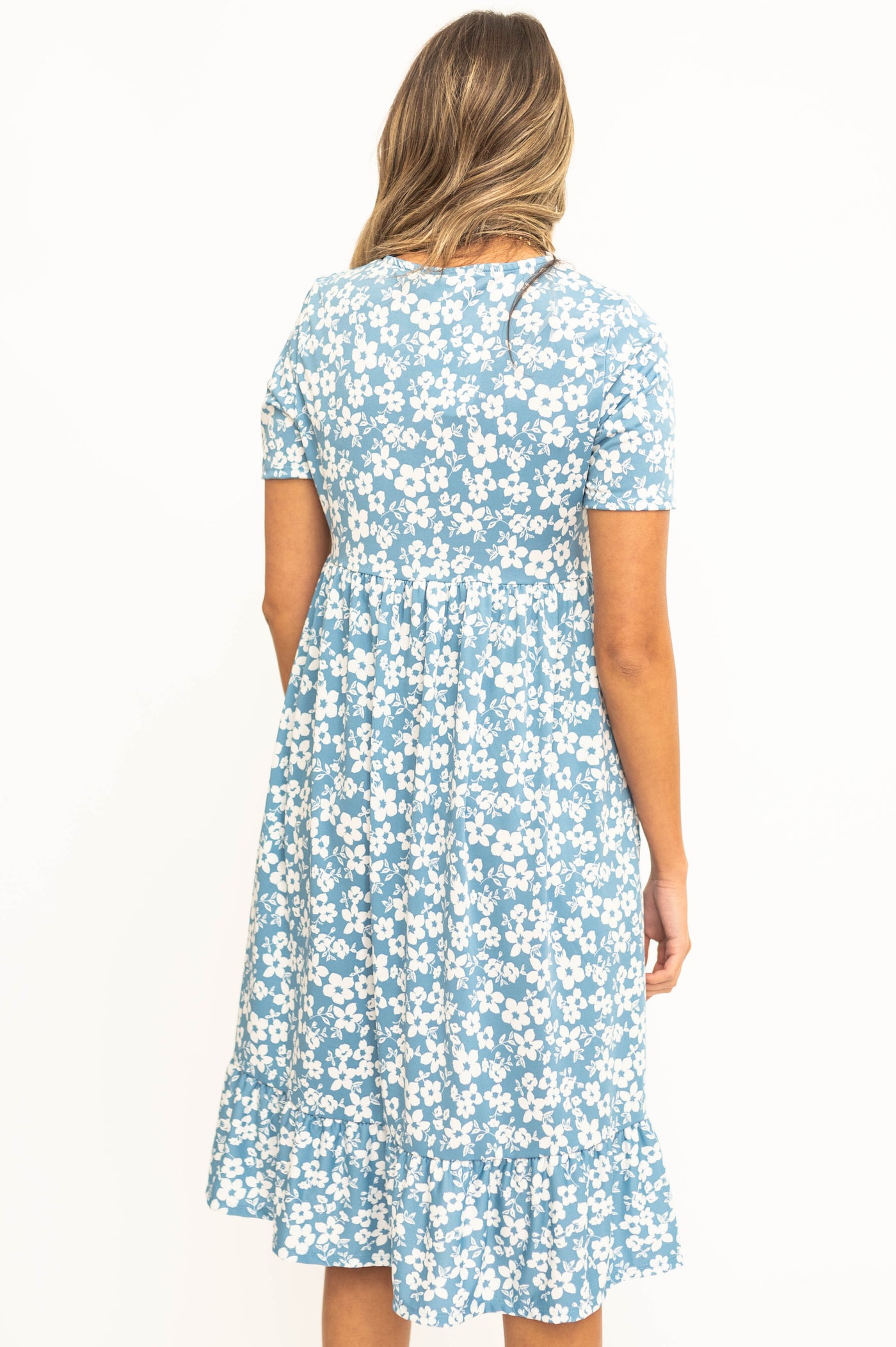 Back view of a blue floral dress