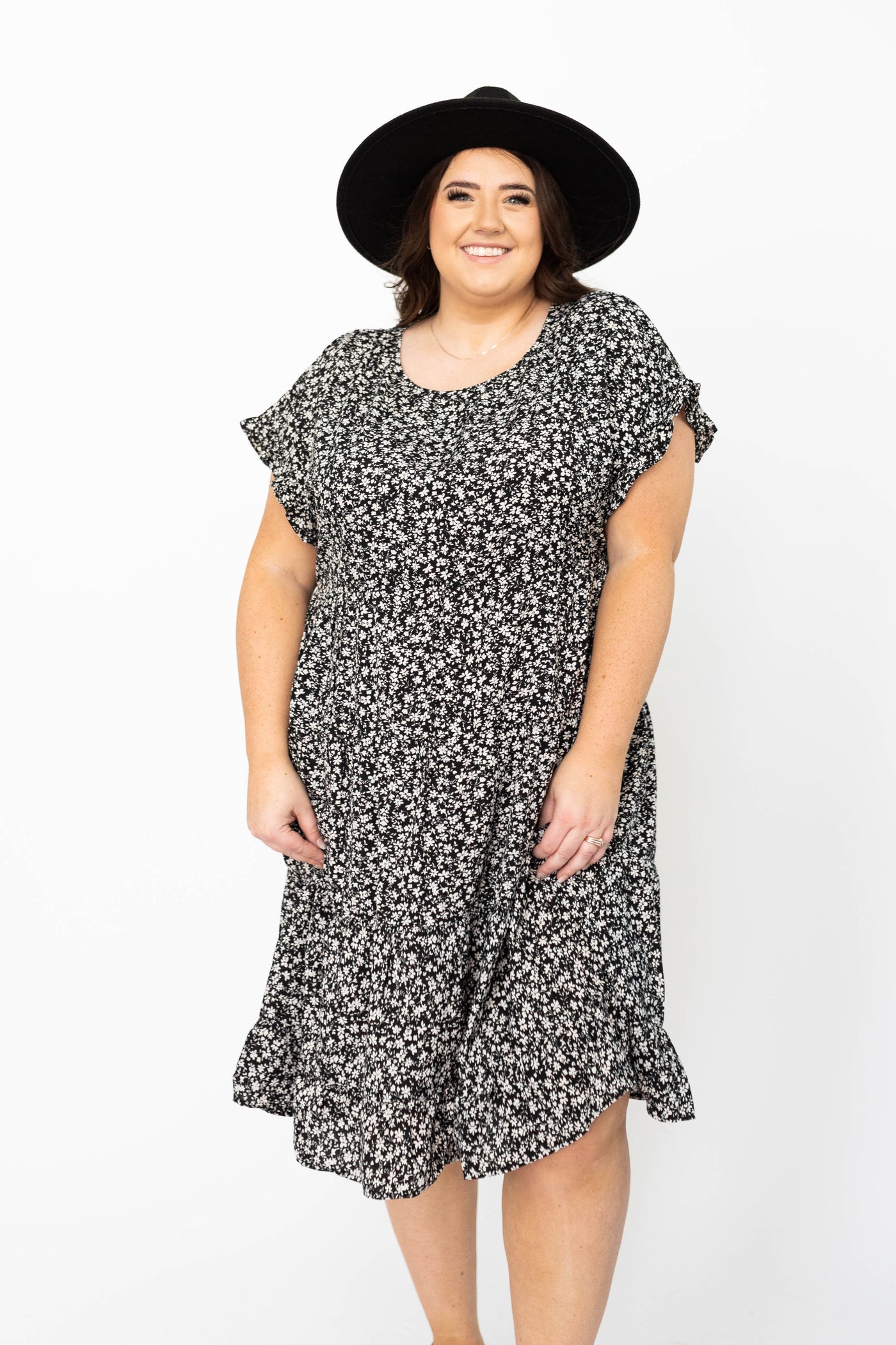 Plus size short sleeve black floral dress with tiered skirt