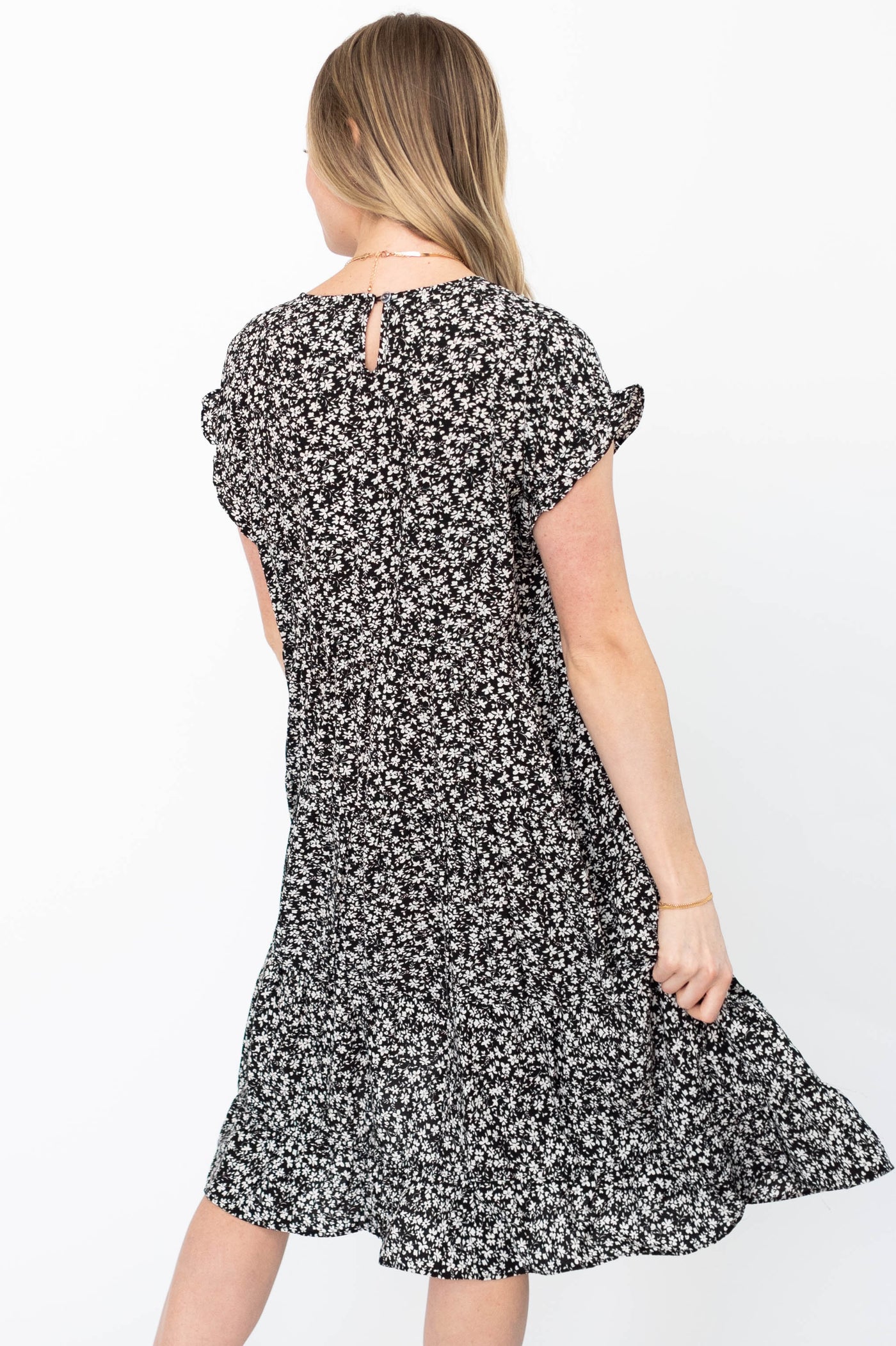 Back view of a black floral dress