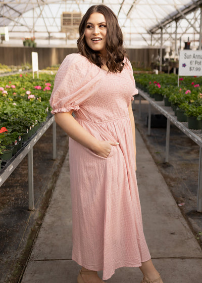 Side view of a dusty pink dress