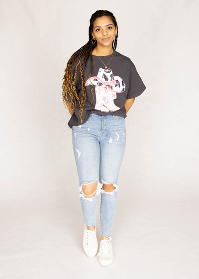 Light denim jeans with distressed knees
