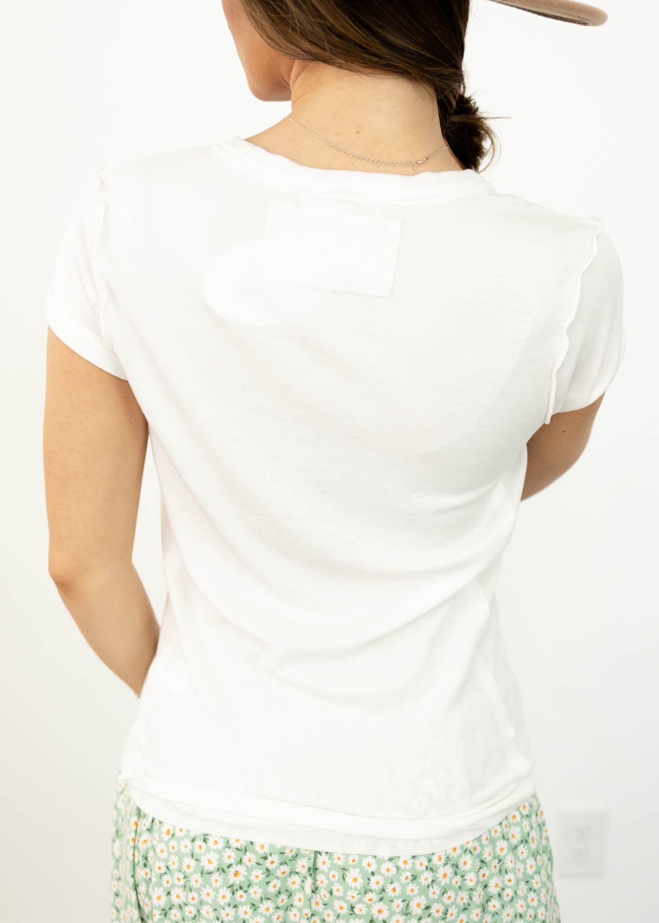 Back view of a short sleeve white top