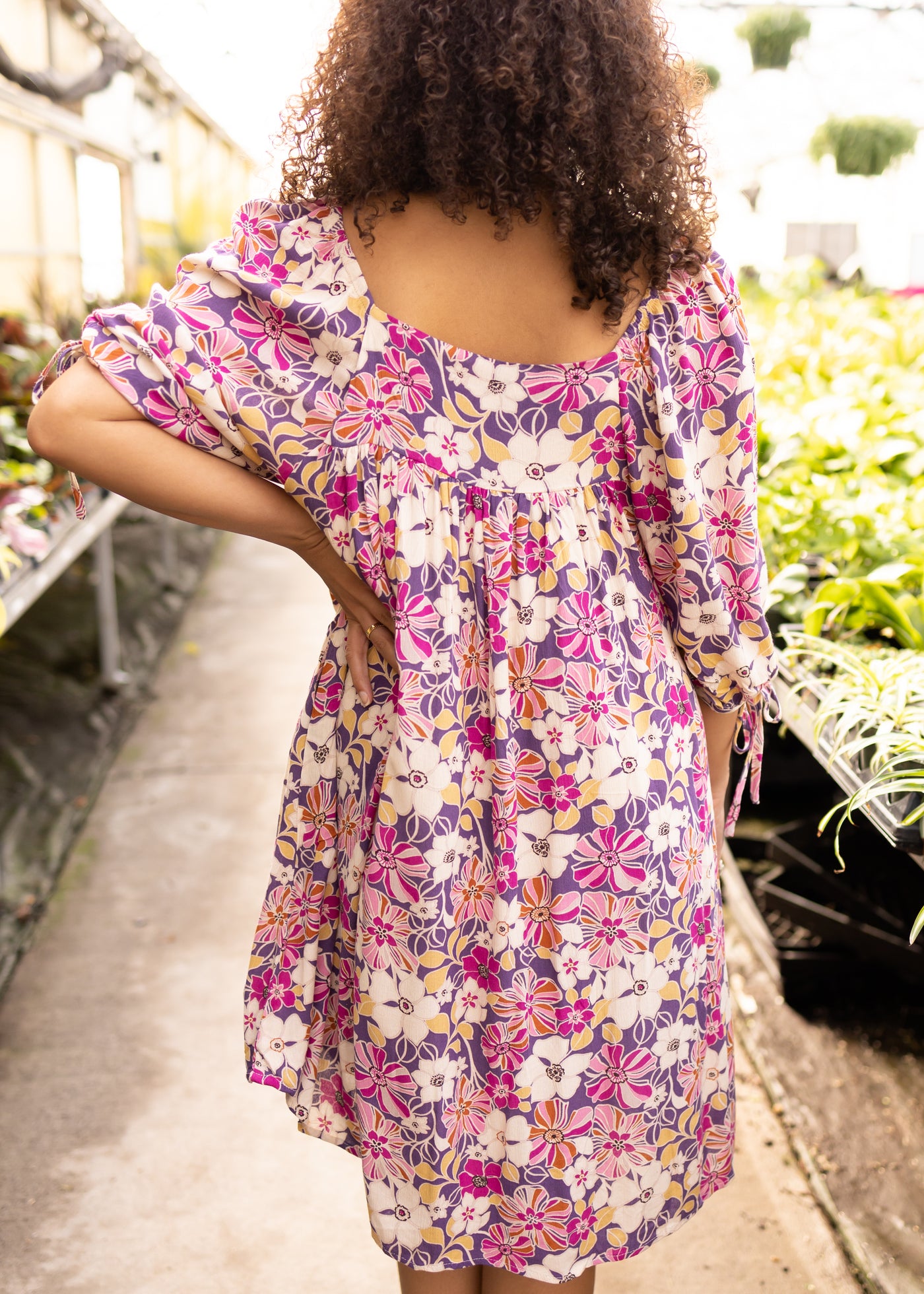 Back view of a violet floral dress