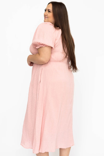 Side view of a plus size mauve dress