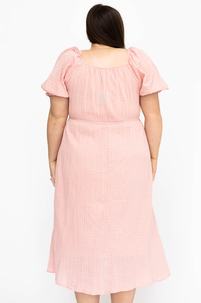 Back view of a plus size mauve dress
