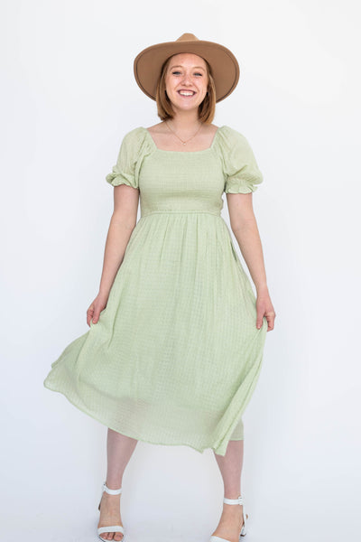 Short sleeve sage dress with smocked bodice